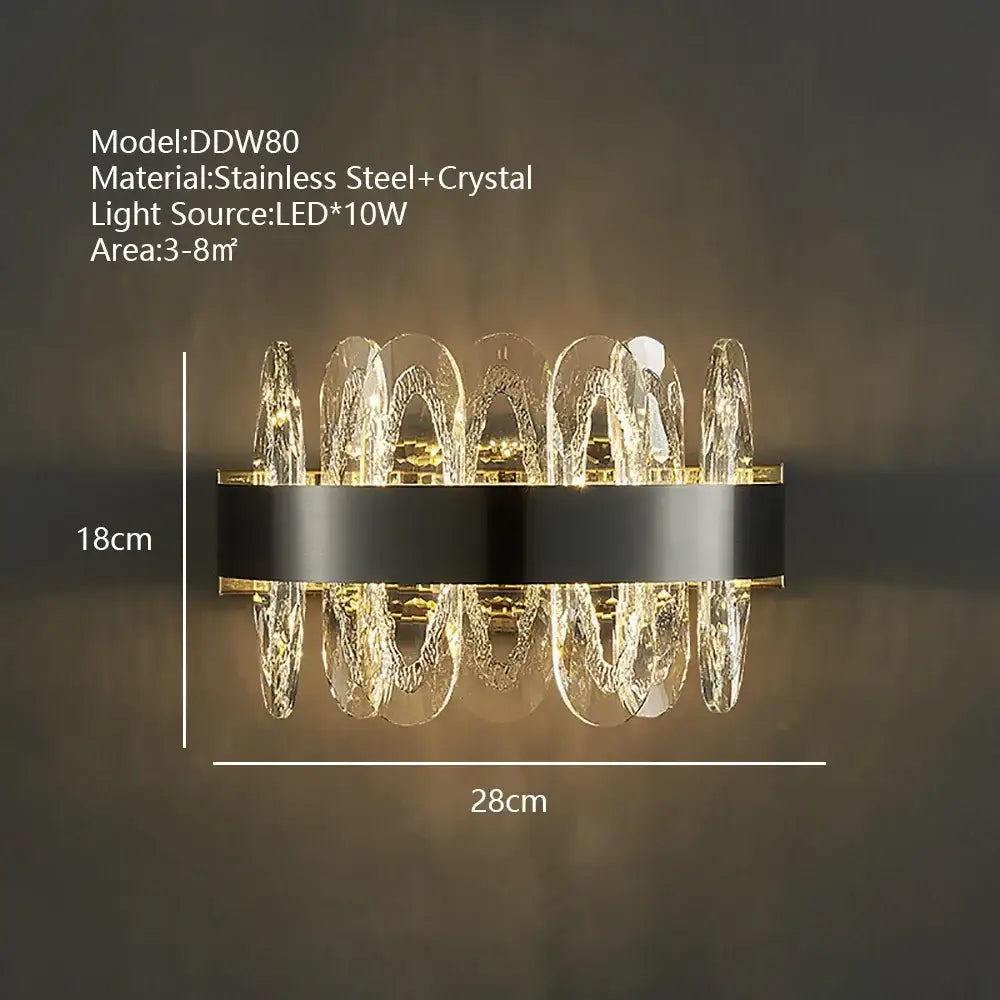 Modern decorbites crystal led wall sconce with black stainless steel base and cascading clear crystals illuminated by led lights
