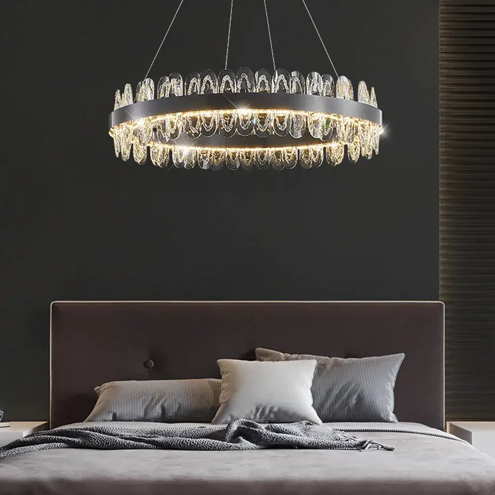 Modern Decorbites crystal led chandelier with sleek black metal frame and cascading clear crystal droplets for living room