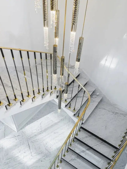 Gold-toned decorbites crystal led large staircase chandelier with cascading crystal pendants and textured metallic rods