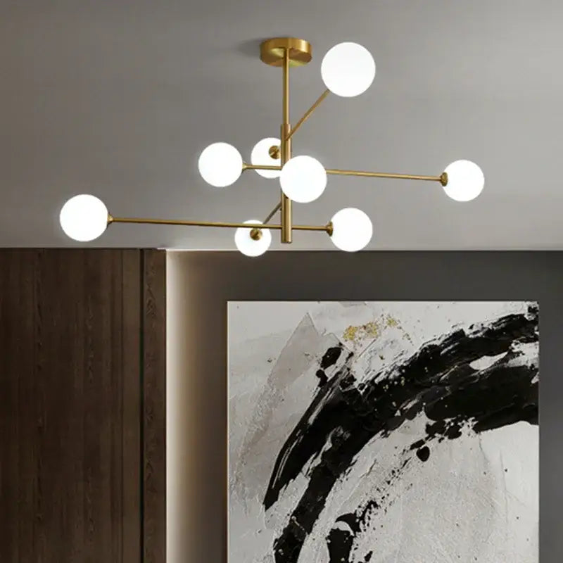 Modern decorbites glass brass chandelier featuring brass finish and white glass bulbs for living room lighting