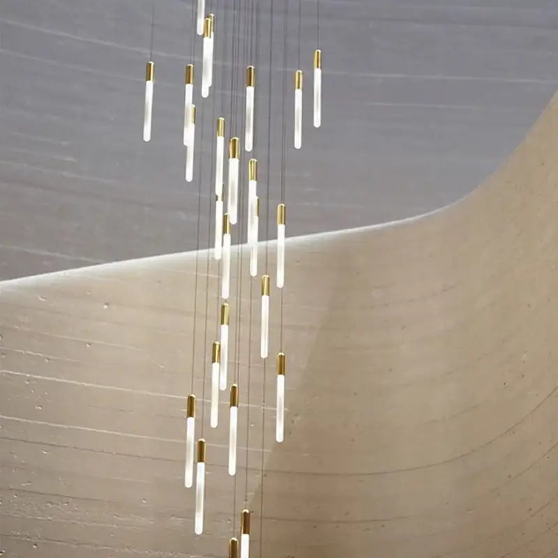Modern decorbites luxe gold tube chandelier with translucent white glass tubes and polished gold metal for dining room lighting