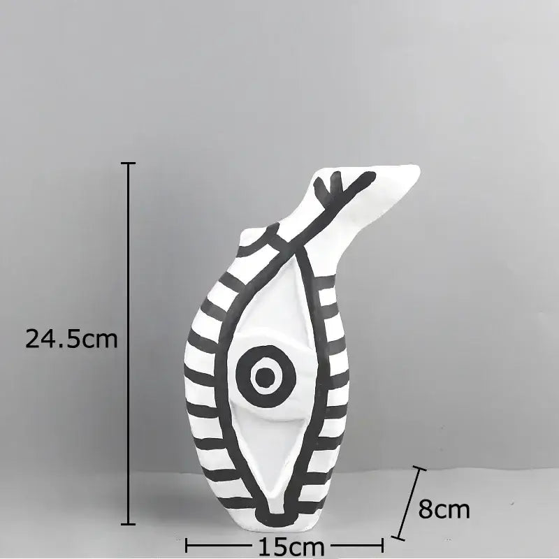 White ceramic decorbites abstract vase with bold black stripes and eye motif in modern design for bedroom decor
