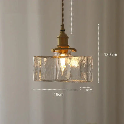 Modern diamond amber glass led pendant light featuring warm-toned textured amber glass and brass fixture for dining room