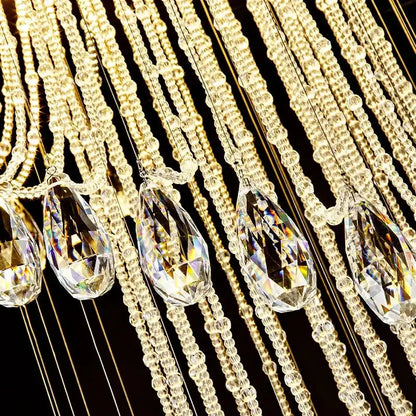 Modern double spiral staircase crystal ceiling chandelier featuring gold-toned chains with teardrop pendants and clear glass beads