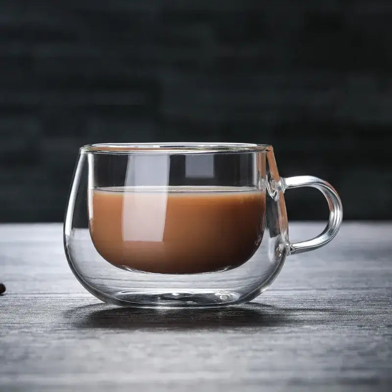 Modern double walled glass coffee mug with handle filled with brown liquid by decorbites glass coffee drinkware cup