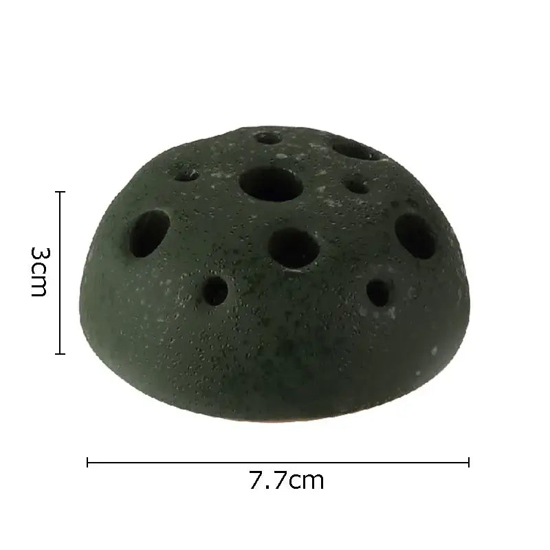 Dark green porous lotus seedpod ceramic incense burner with multiple circular holes for living room decor