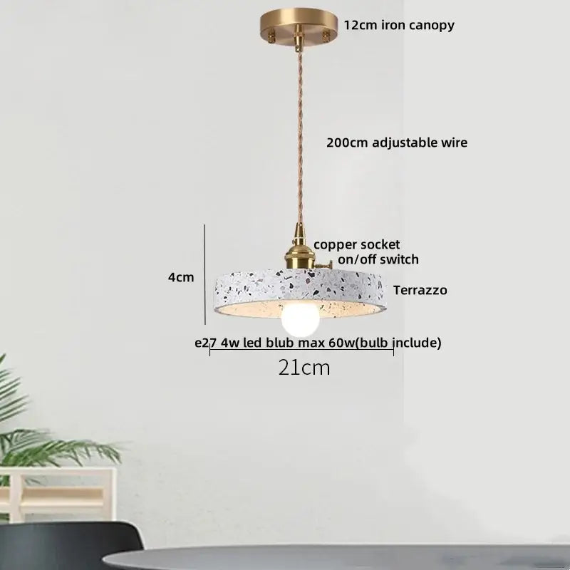 Modern earthy terrazzo stone led pendant light with circular terrazzo shade brass iron canopy and copper socket for dining room decorbites
