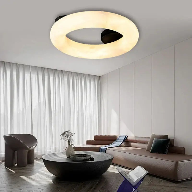 Modern elegant alabaster marble ceiling chandelier with warm diffused glow and sleek black accents for living room