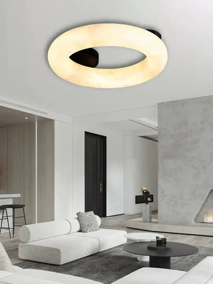 Modern elegant alabaster marble ceiling chandelier with warm diffused glow and sleek black inner ring for living room