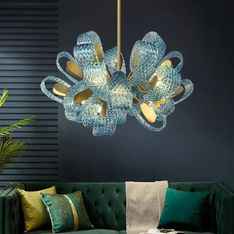 Modern elegant blue copper led flower chandelier with translucent blue glass petals and gold-toned accents for living room decorbites elegant blue copper led