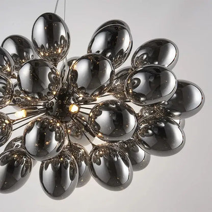 Modern elegant grape glass chandelier with glossy black spherical globes arranged radially for dining room decorbites elegant grape