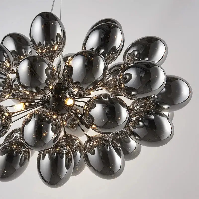 Modern elegant grape glass chandelier with glossy black spherical globes arranged radially for dining room decorbites elegant grape