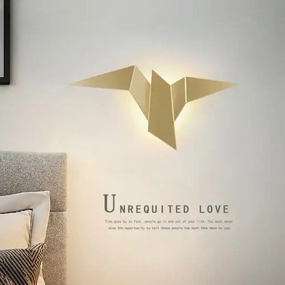 Gold-colored origami bird wall lamp with sleek geometric design from decorbites elegant triangular led collection for bedroom study