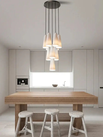 Modern elegant white glass cup chandelier pendant light with multiple frosted shades on dark metal decorbites elegant white fixture