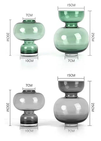Modern emerald green gourd vase set featuring two glass vases in translucent green and smoky gray with elegant curves
