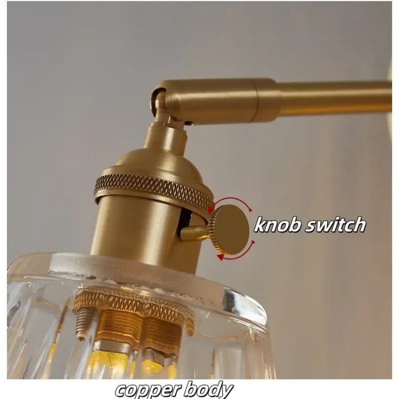 Modern faceted glass copper wall lights featuring a copper-finished industrial lamp with clear shade and textured knob switch