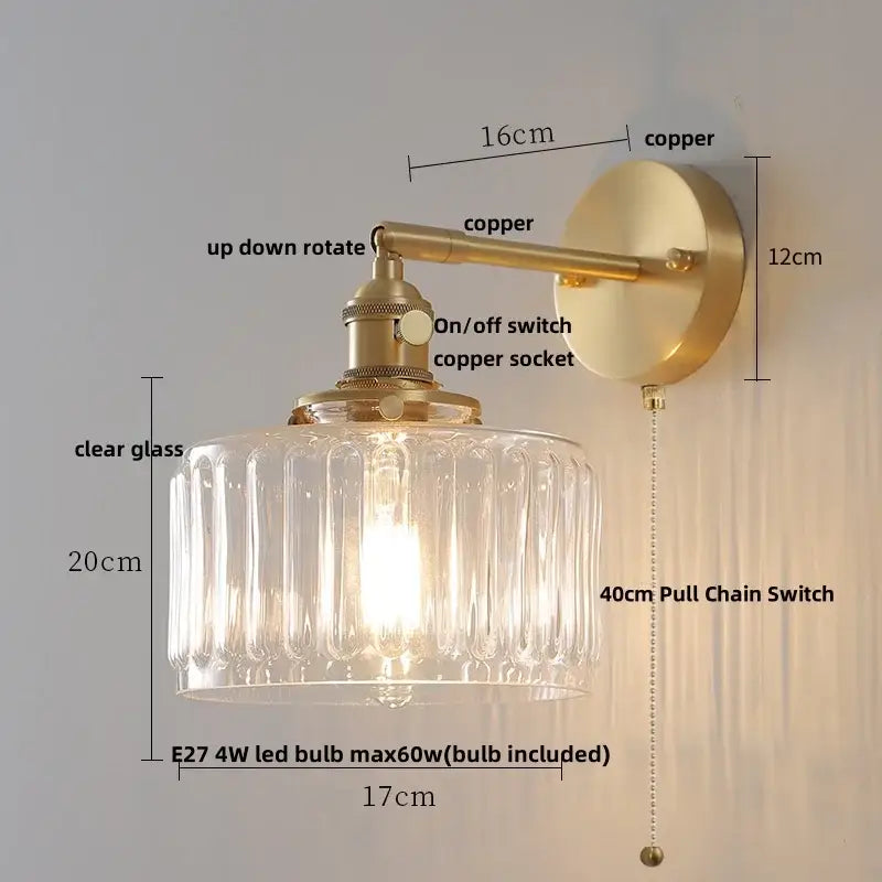 A vintage-style bedroom sconce with glass copper wall lights featuring a brass copper finish and ribbed glass shade