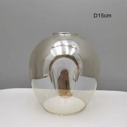 Modern faceted glass shade replacement with reflective silver interior and transparent exterior for living room lamp cover