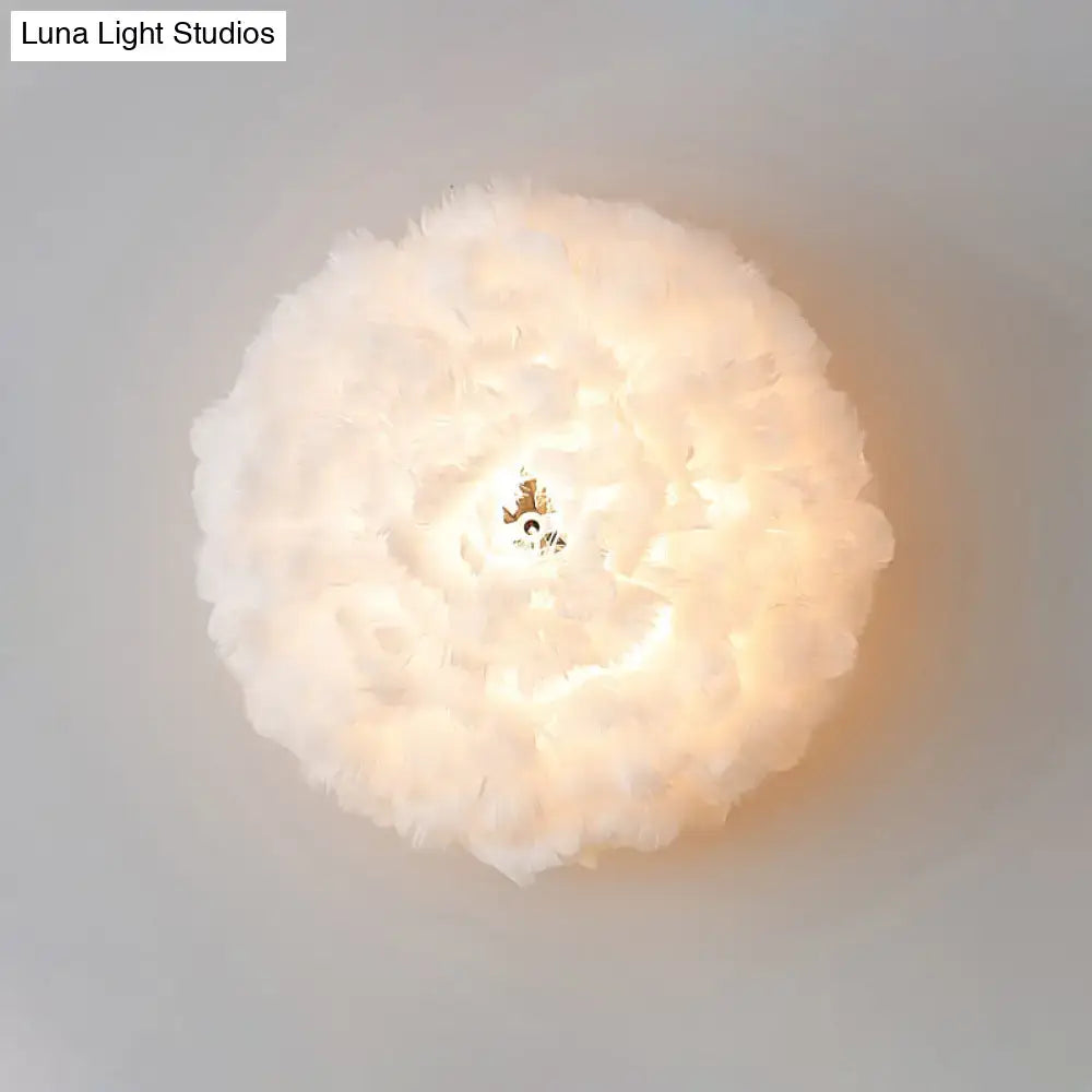 Modern feather material wall light with soft white feathers and grey white tones for bedroom sconce lighting