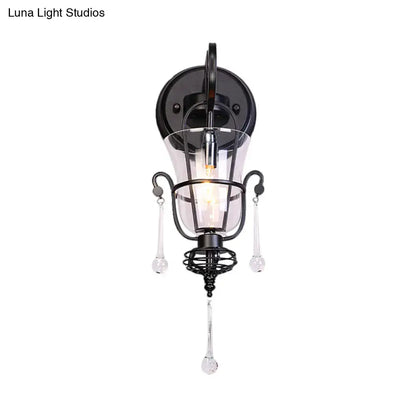 Modern flared black metal wall lamp with crystals featuring clear glass accents and dangling teardrop pendants for bedroom use