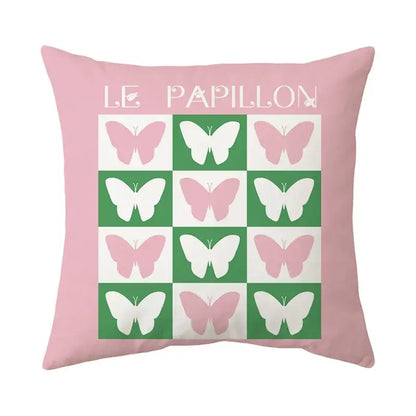 Pink throw pillow with pink and white butterfly grid on green and white squares and le papillon text decorbites butterfly pillowcase