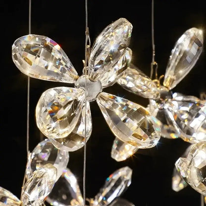 A modern floral decorbites crystal led chandelier with clear faceted glass petals for dining room lighting