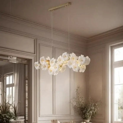 Elegant white floral pendant light with gold-toned metal finish offering practical illumination for kitchen spaces