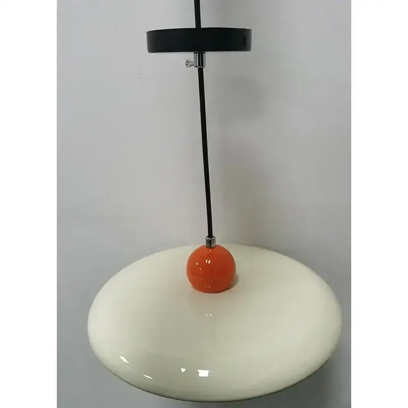 Modern french cream metal pendant light with glossy ceramic finish and vibrant orange accent for dining room use