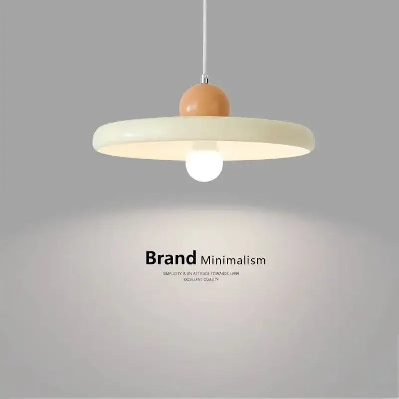 Modern french cream metal pendant light with matte finish and orange spherical accent for dining room lighting