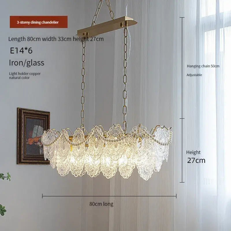 Elegant gold-toned iron and clear glass 3-tier led chandelier with intricate lace-like detailing for modern living room decorbites clear glass