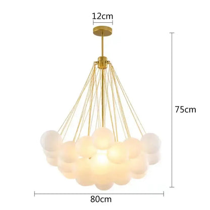 Modern frosted glass ball cloud pendant lights with gold-toned chandelier and frosted glass spheres for dining room
