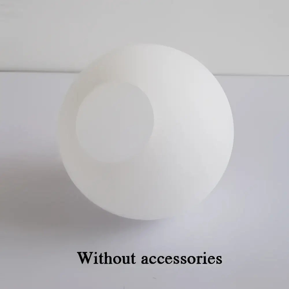 Modern frosted glass ball pendant light with gold ring featuring a white matte glass ball with circular cutout decorbites glass ball