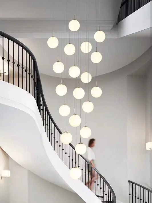 Modern frosted glass cascading chandelier pendant light with polished steel light body for staircase lighting