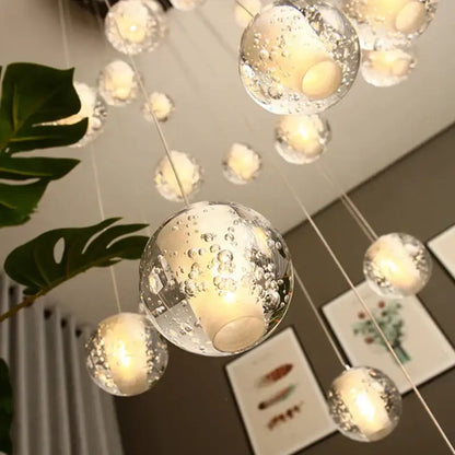Modern frosted glass crystal ceiling chandelier with clear glass spheres and warm led lights by decorbites crystal ceiling