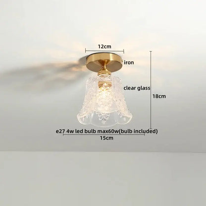 A vintage-style ceiling light with brass iron base and etched clear glass shade for modern frosted glass led ceiling use