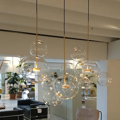 Modern frosted white bubble ball pendant light with clear glass bubble shades and gold-toned metal fixtures for kitchen island decorbites bubble ball pendant