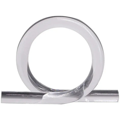 A sleek transparent adhesive tape roll with metallic silver backing ideal for modern geometric acrylic rope home decor