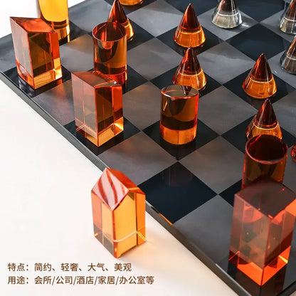 Orange translucent acrylic chess set with modern geometric design on black and gray board for home decor