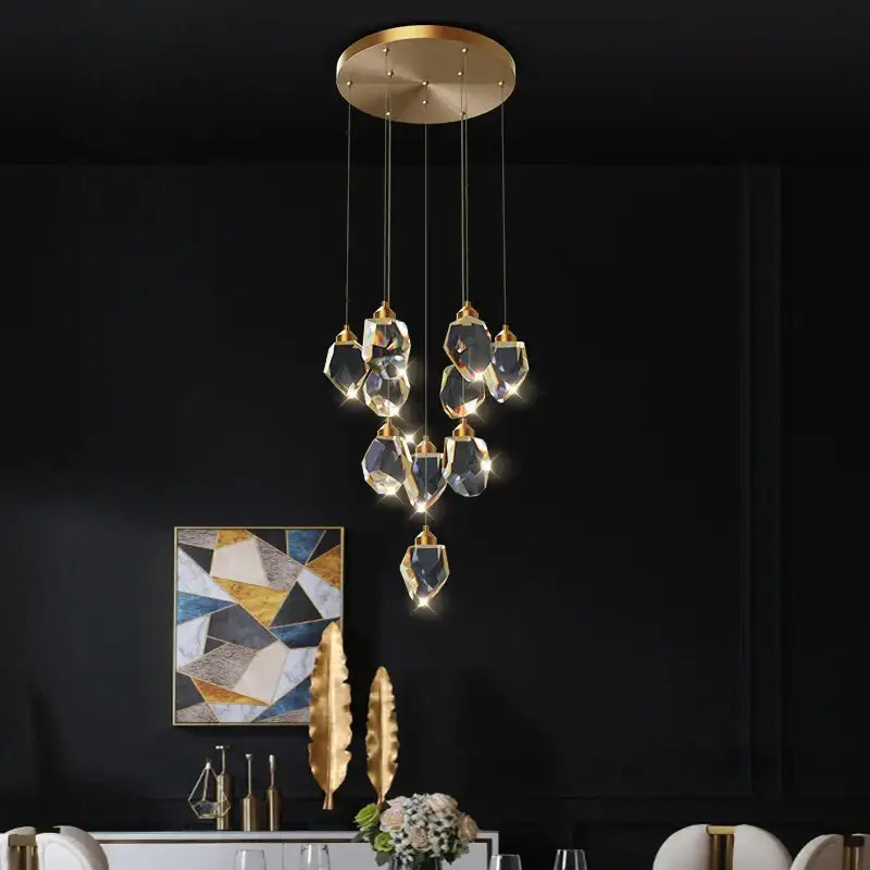 A modern geometric black and gold decorbites crystal diamond chandelier with faceted crystal pendants for stairwell decor