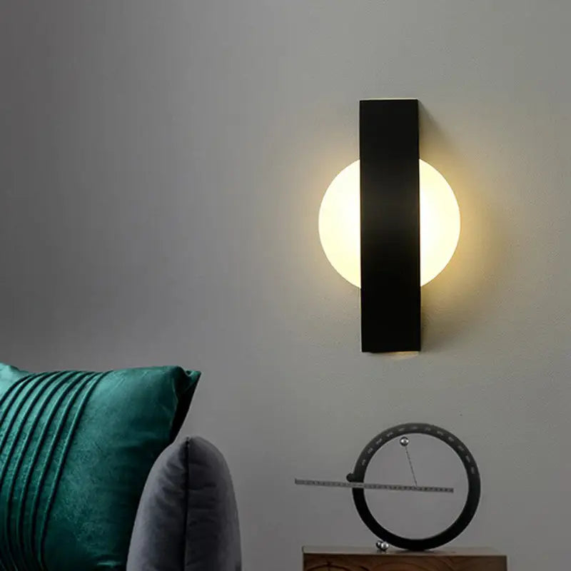 Modern geometric black led wall sconce with circular warm light fixture for living room wall lighting