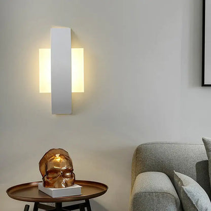 Modern white rectangular led wall sconce with warm glowing light for stylish living room illumination