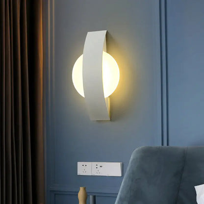 Modern white curved wall sconce with warm led light for living room featuring a sleek geometric design
