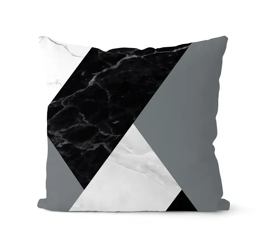 A modern geometric black and white pillowcase set featuring bold black marble white marble and gray triangular panels