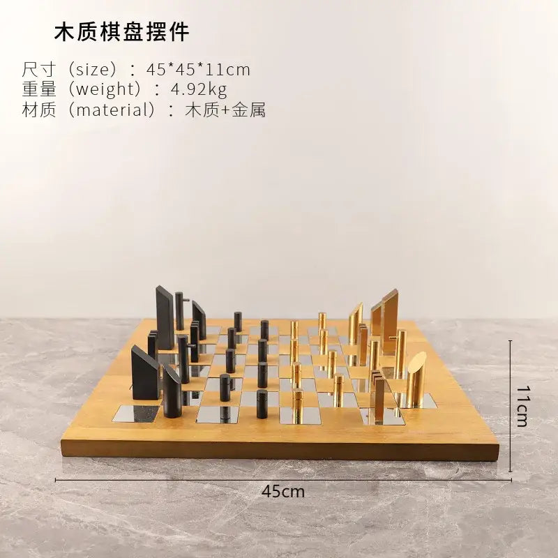 Modern geometric block chess set with sleek black and gold metallic pieces on light wooden board for living room decor