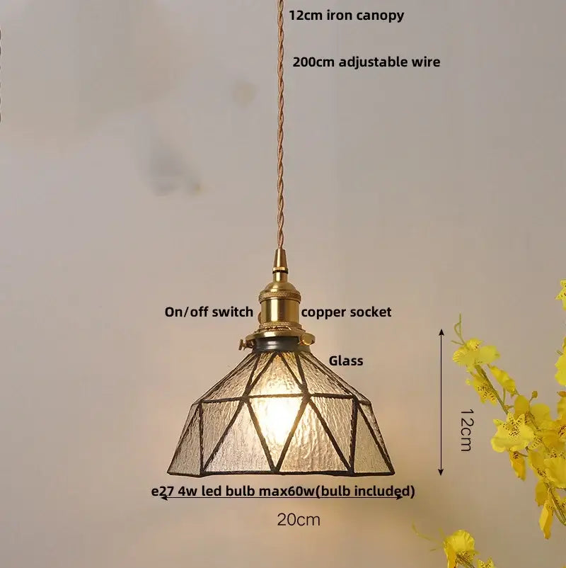 Antique brass-finished pendant light with geometric blue glass shade and copper wiring for dining room decorbites blue glass