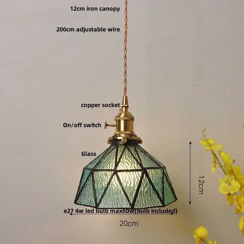 A modern geometric pendant light with blue glass and brass finish ideal for dining room decorbites blue glass collection