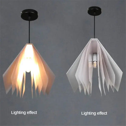 Two modern geometric decorbites book pendant lamps with layered paper panels in amber and white for bedroom lighting