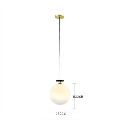 Modern geometric brass and black glass pendant light with frosted glass globe for dining room use