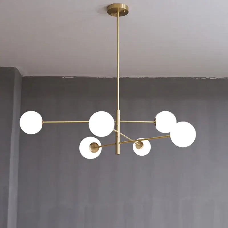Modern geometric decorbites brass chandelier with six frosted glass spheres for living room decor and lighting