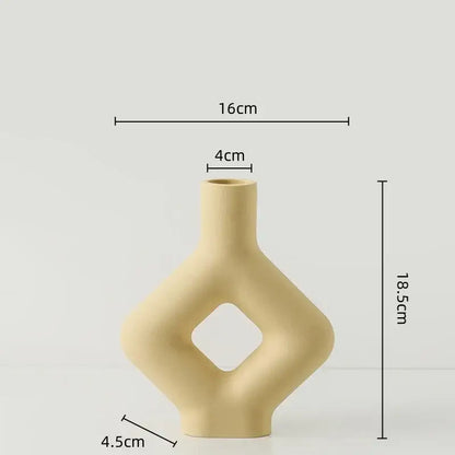 Beige decorbites geometric ceramic vase with diamond cutout and sleek modern contours for living room decor